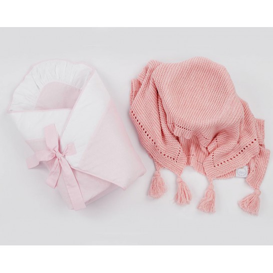 A pink baby swaddling wrap with a pink scented blanket