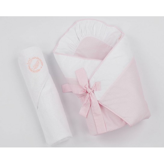 A pink baby swaddling wrap with a pink terry bath towel.