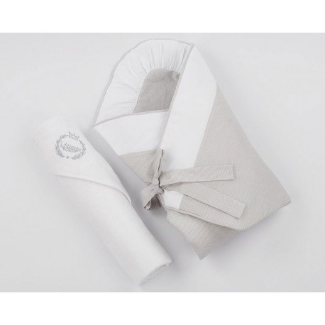 A grey baby swaddling wrap with a grey terry bath towel.