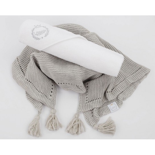 A grey scented blanket with a grey terry bath towel