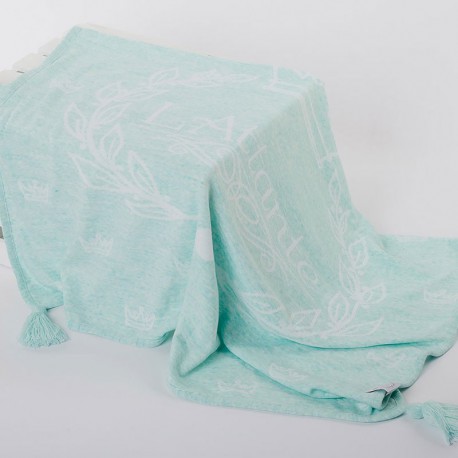 A woven, mint blanket (throw)